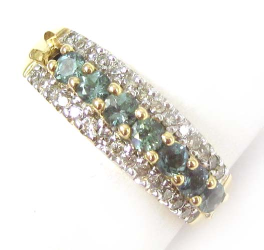 Appraisal: ALEXANDRITE DIAMOND AND FOURTEEN KARAT GOLD RING set with seven