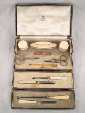 Appraisal: Asprey A manicure set containing two ivory pots and buffer