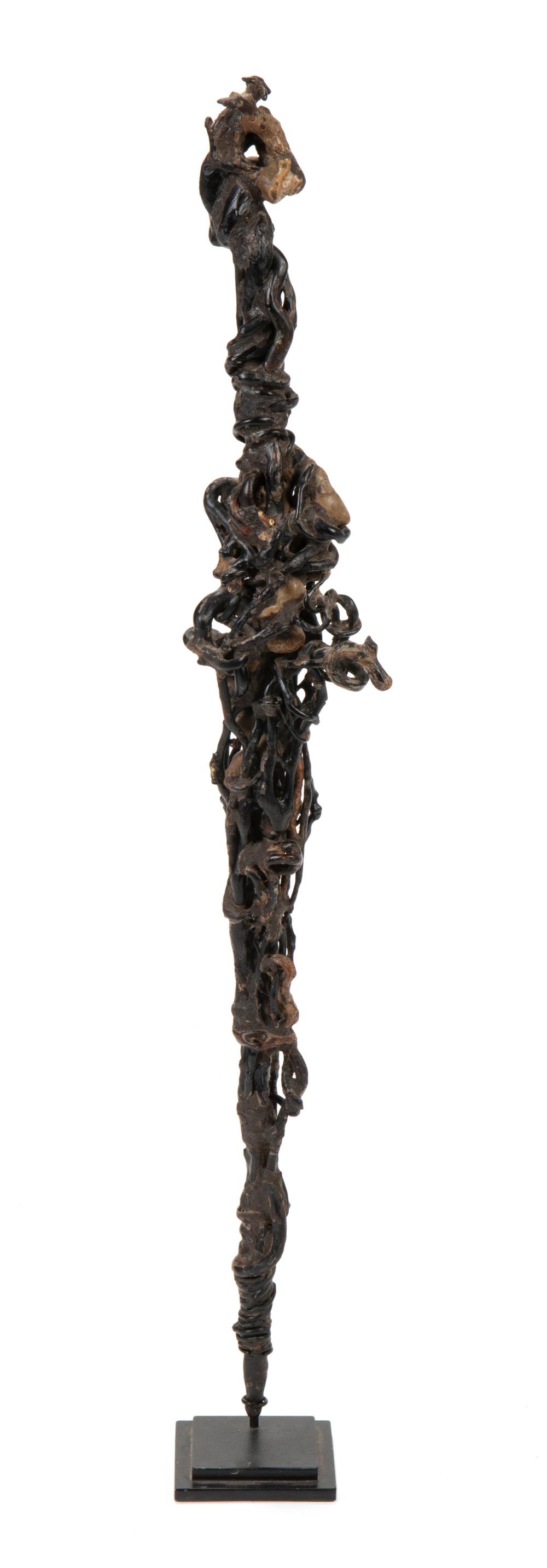 Appraisal: An Indonesian black coral shaman's staff th Century The wooden