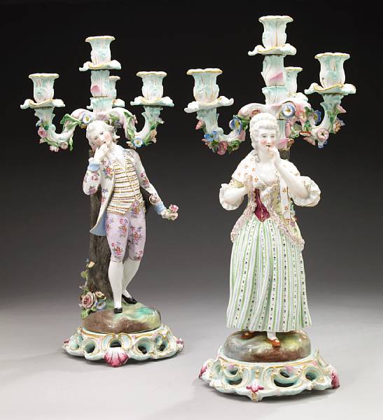 Appraisal: A pair of German porcelain figural candelabra late th century