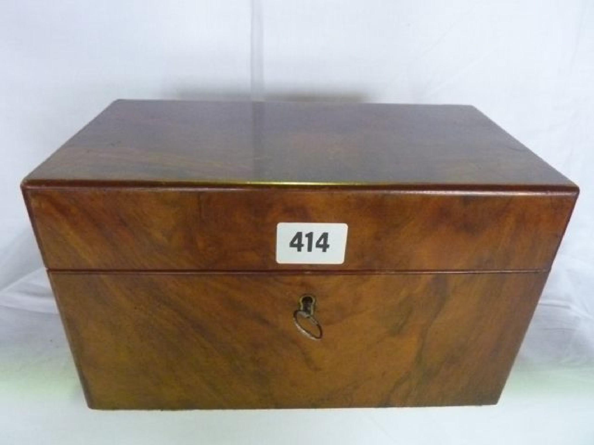 Appraisal: A Victorian walnut tea caddy of rectangular form the interior