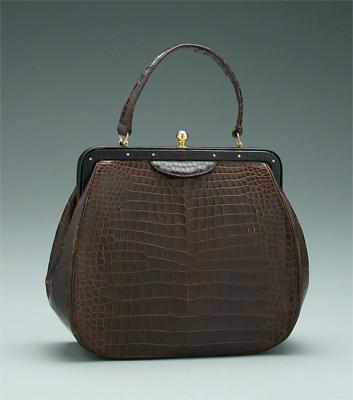 Appraisal: Nettie Rosenstein alligator handbag interior with matching coin purse and