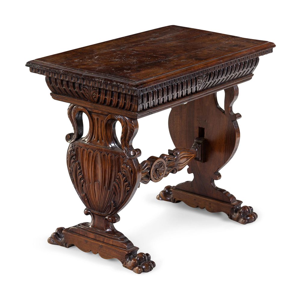 Appraisal: A Renaissance Revival Carved Walnut Low Trestle Table A Renaissance