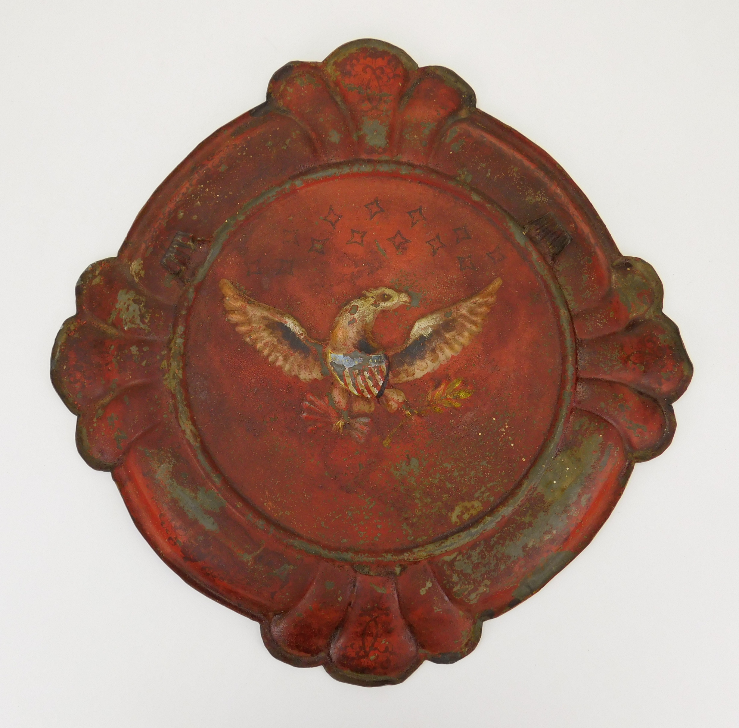 Appraisal: Victorian stamped metal flue cover decorated with eagle with shield