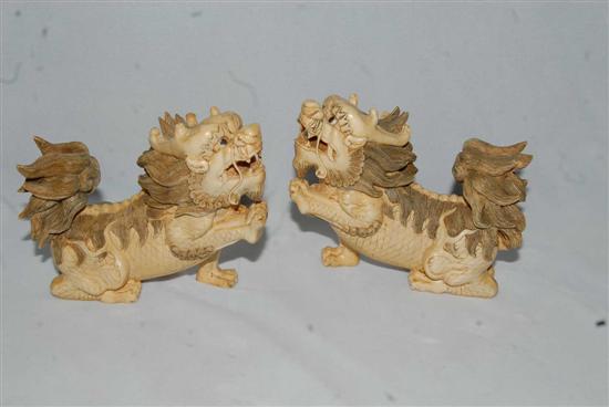 Appraisal: PAIR CHINESE IVORY FOO LIONS The opposing snarling lions each