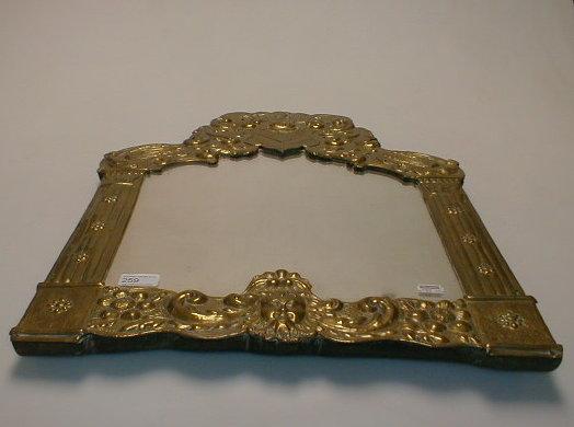 Appraisal: An early thC wall mirror the shaped glass enclosed within