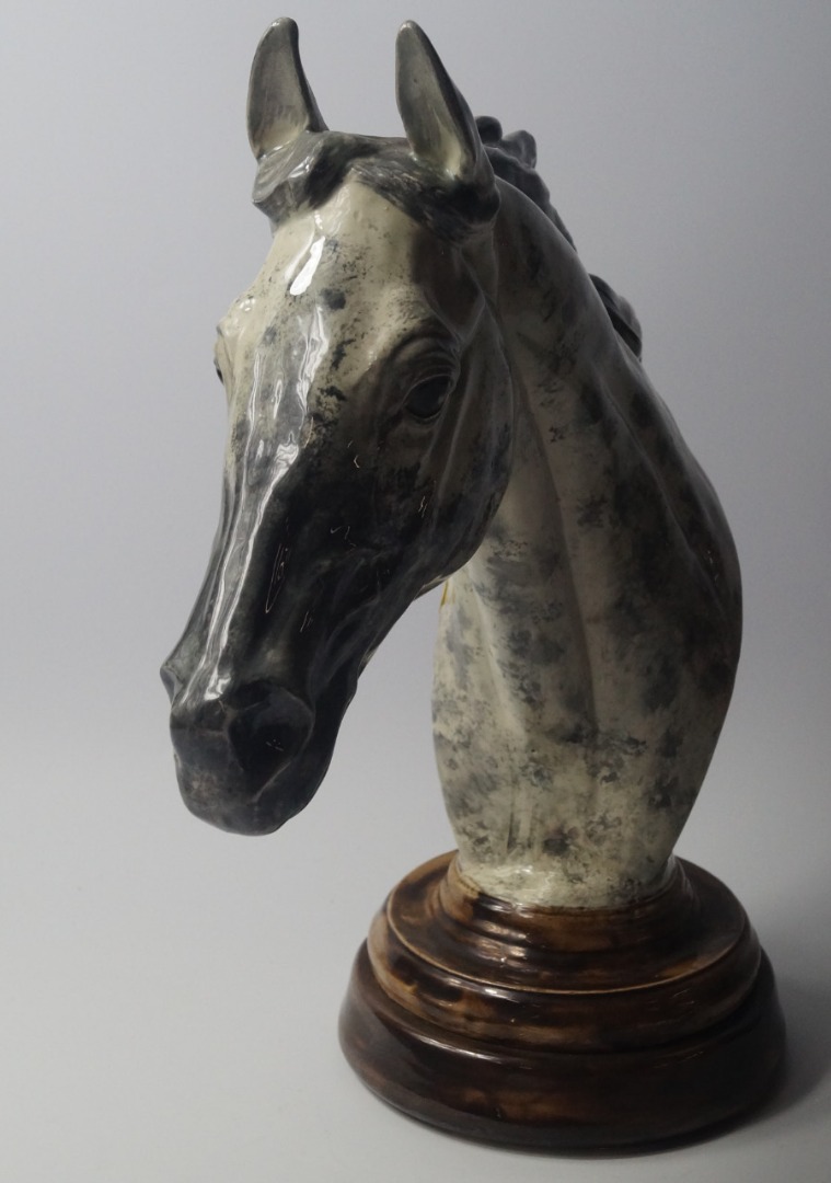 Appraisal: A pottery sculpture of a dappled grey horse's head signed