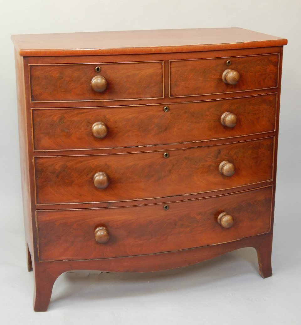 Appraisal: A thC flame figured mahogany bowfronted chest of two short