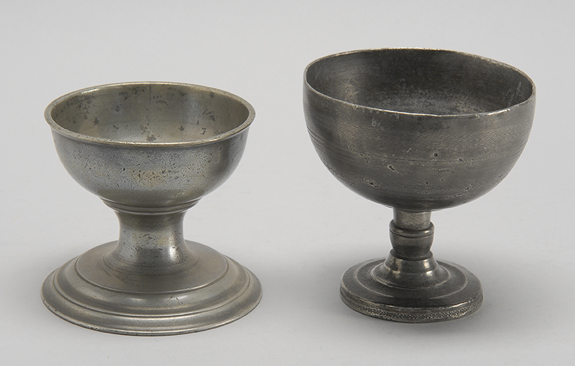 Appraisal: TWO PEWTER CUP SALTS th CenturyBoth with pedestal bases Height