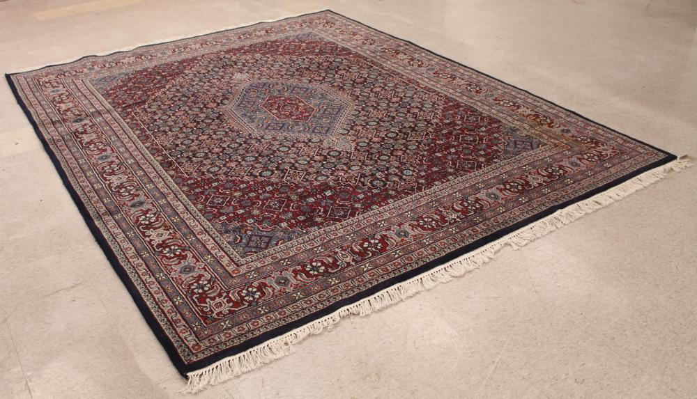 Appraisal: HAND KNOTTED ORIENTAL CARPET Indo-Bijar central medallion and overall Herati