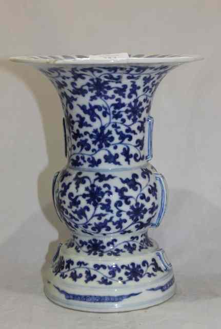 Appraisal: A CHINESE GU VASE with blue trailing foliage Daoguang mark