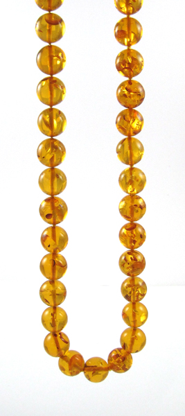 Appraisal: BALTIC PRESSED AMBER BEAD NECKLACE measuring inches in length and