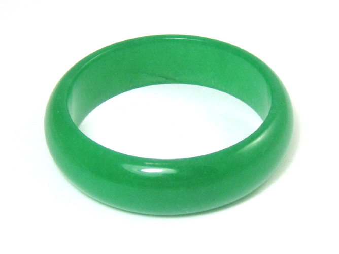 Appraisal: JADE BANGLE BRACELET in a dark green with comfort fit