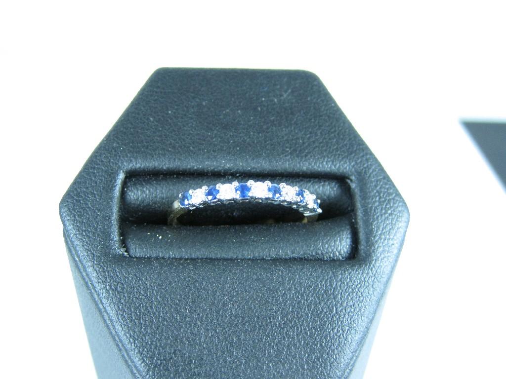 Appraisal: A Sapphire and Diamond half-eternity Ring claw-set alternating circular-cut stones