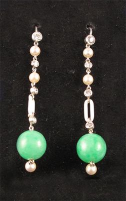 Appraisal: A pair of jade drop earrings The round jade beads