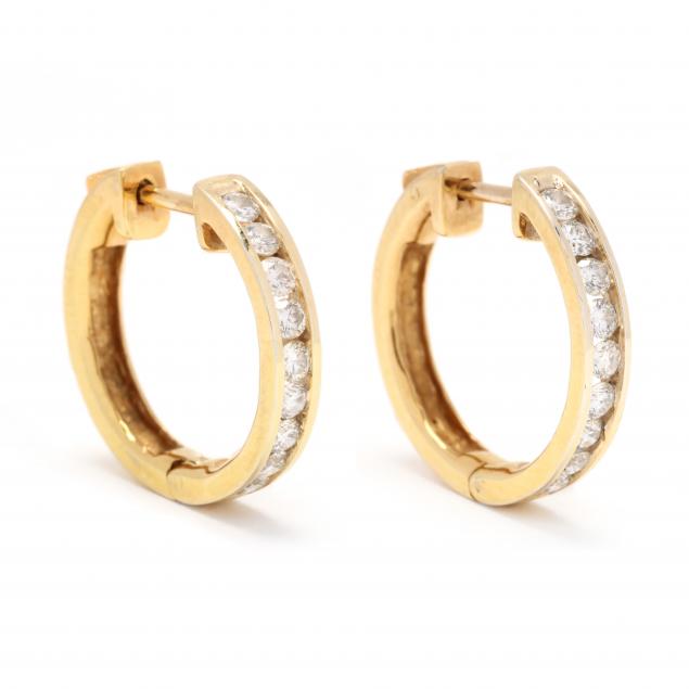 Appraisal: GOLD AND DIAMOND HOOP EARRINGS The hinged hoops channel set