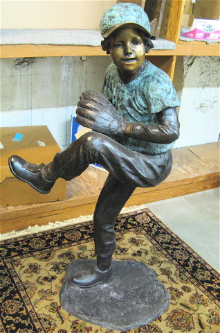 Appraisal: FIGURAL BRONZE BALLPARK SCULPTURE the figure of a young pitcher