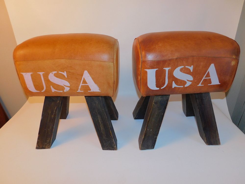 Appraisal: PAIR USA POMMEL HORSE STOOLS Pair of custom wood stools