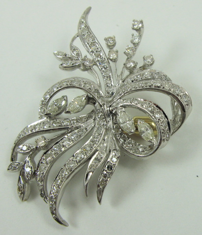 Appraisal: DIAMOND AND EIGHTEEN KARAT GOLD BROOCH set with four marquise-cut