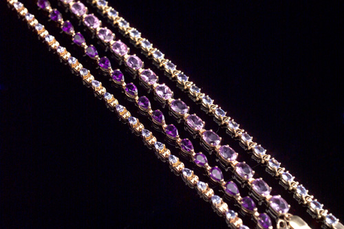 Appraisal: JEWELRY GROUP Four link bracelets two tanzanite and two amethyst