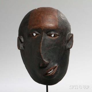 Appraisal: Makonde Carved Wood Deformity Mask with partially blackened surface and