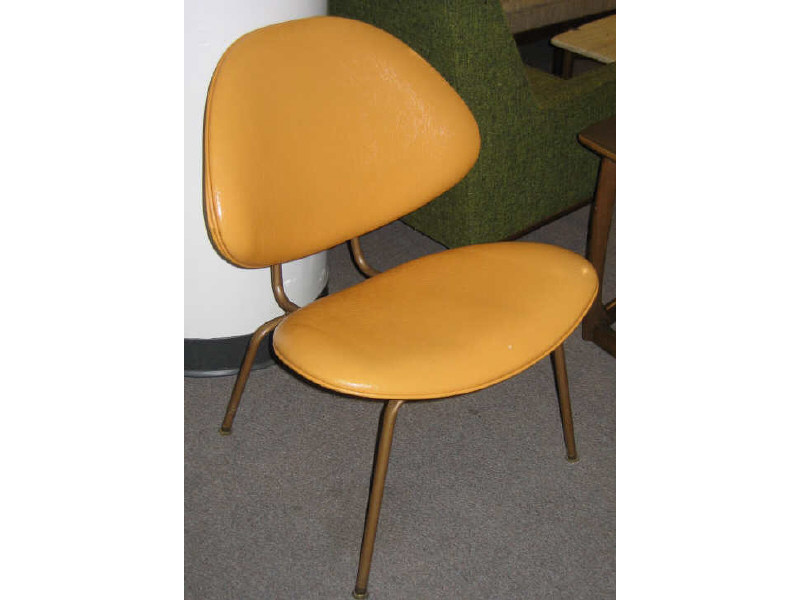 Appraisal: HOMECREST COMPANY WADENA MINNESOTA Pair of orange vinyl upholstered contour