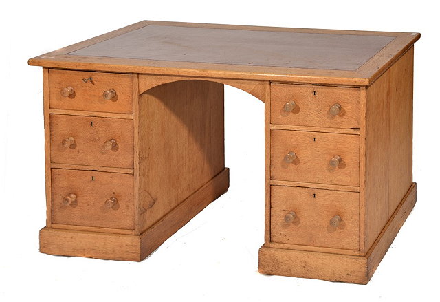 Appraisal: A VICTORIAN OAK PARTNER'S DESK by Holland Sons with red