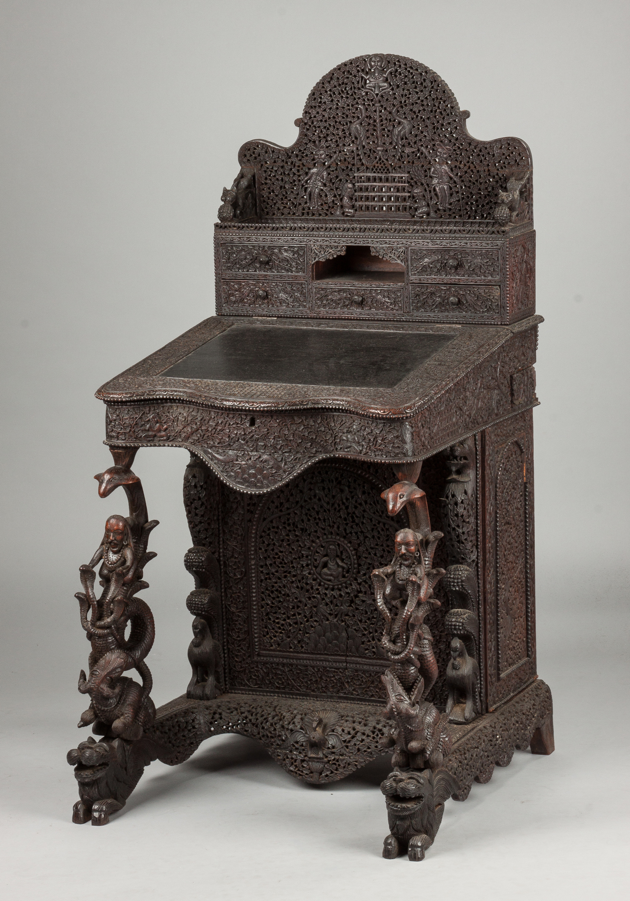 Appraisal: Elaborately Carved Indian Lift-Top Desk with Drawers Mid th cent