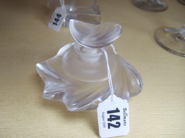 Appraisal: A Lalique clear and frosted glass scent bottle and stopper