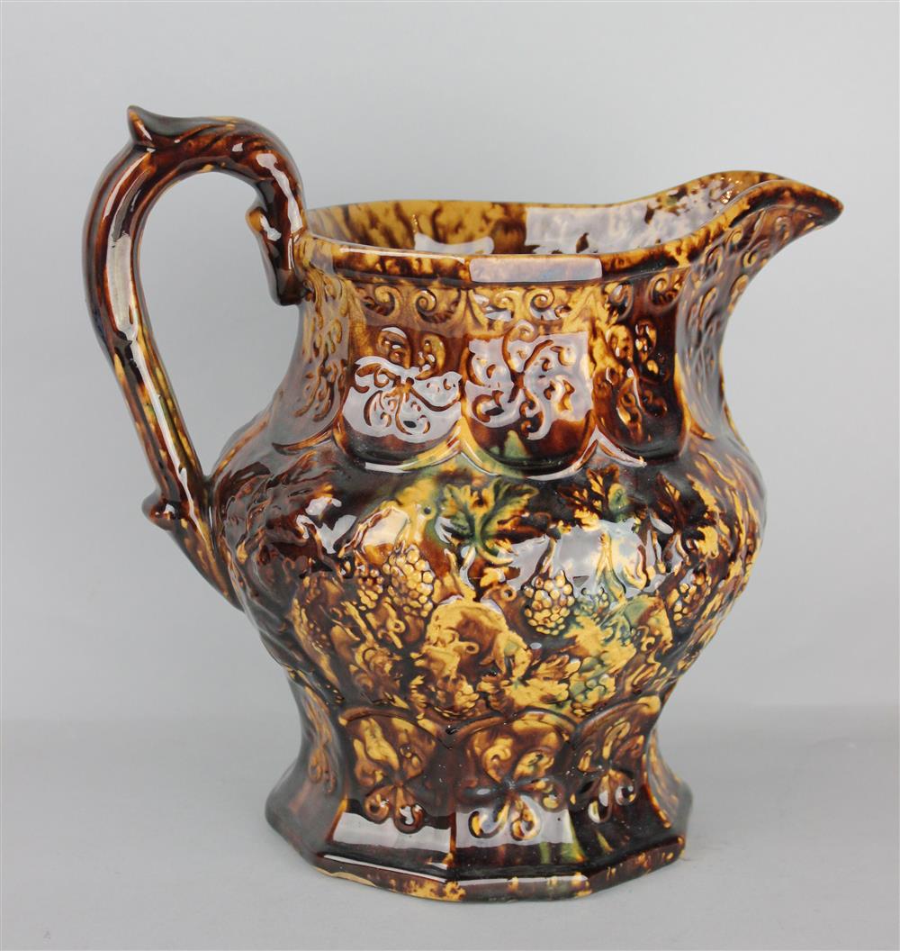 Appraisal: TORTOISESHELL GLAZED BENNINGTON TYPE LARGE JUG late th C with