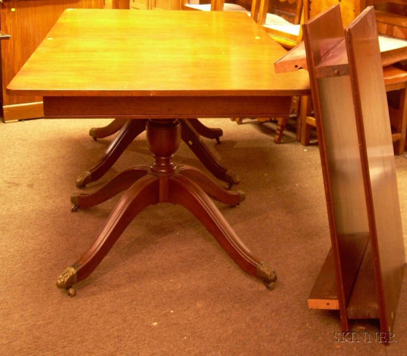 Appraisal: Georgian-style Mahogany Double-pedestal Dining Table with cast brass-mounted feet two