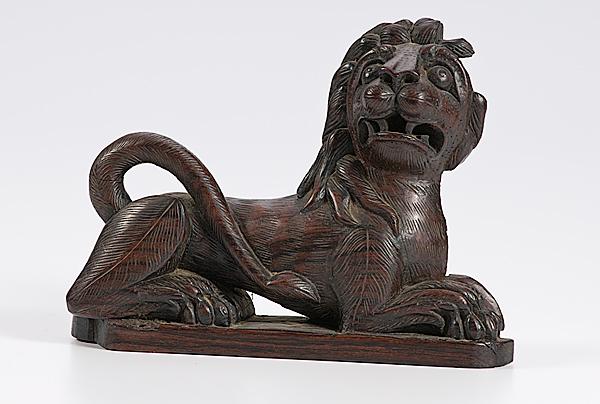 Appraisal: CARVED ROSEWOOD ARCHITECTURAL LION English th century an architectural fragment