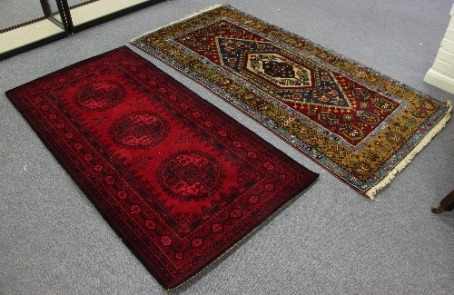 Appraisal: An Oriental rug with white and blue lozenge medallion on