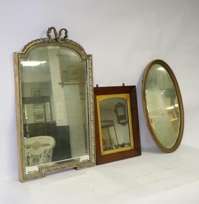 Appraisal: A gilt framed wall mirror with ribbon cresting above an