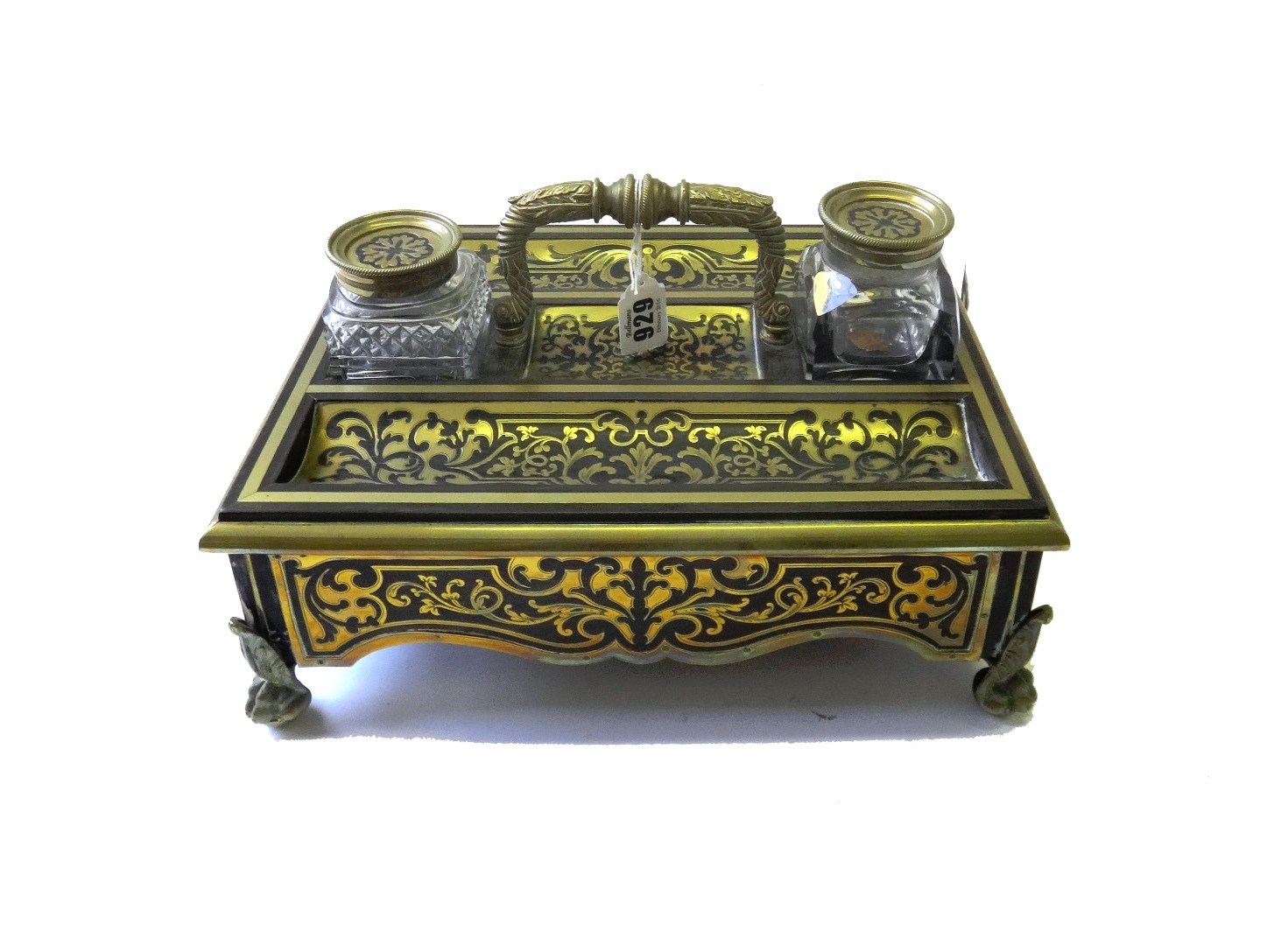 Appraisal: A Victorian brass inlaid tortoiseshell desk set to include a