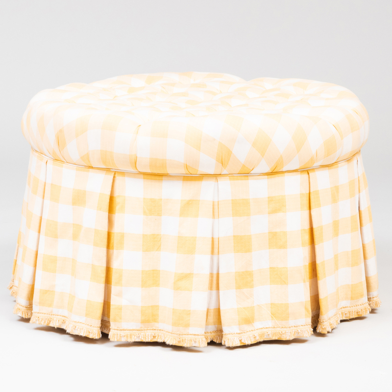 Appraisal: YELLOW GINGHAM TUFTED UPHOLSTERED OTTOMAN On casters x in diam