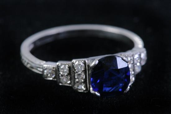 Appraisal: EDWARDIAN PLATINUM SAPPHIRE AND DIAMOND RING Round Kashmir sapphire centered