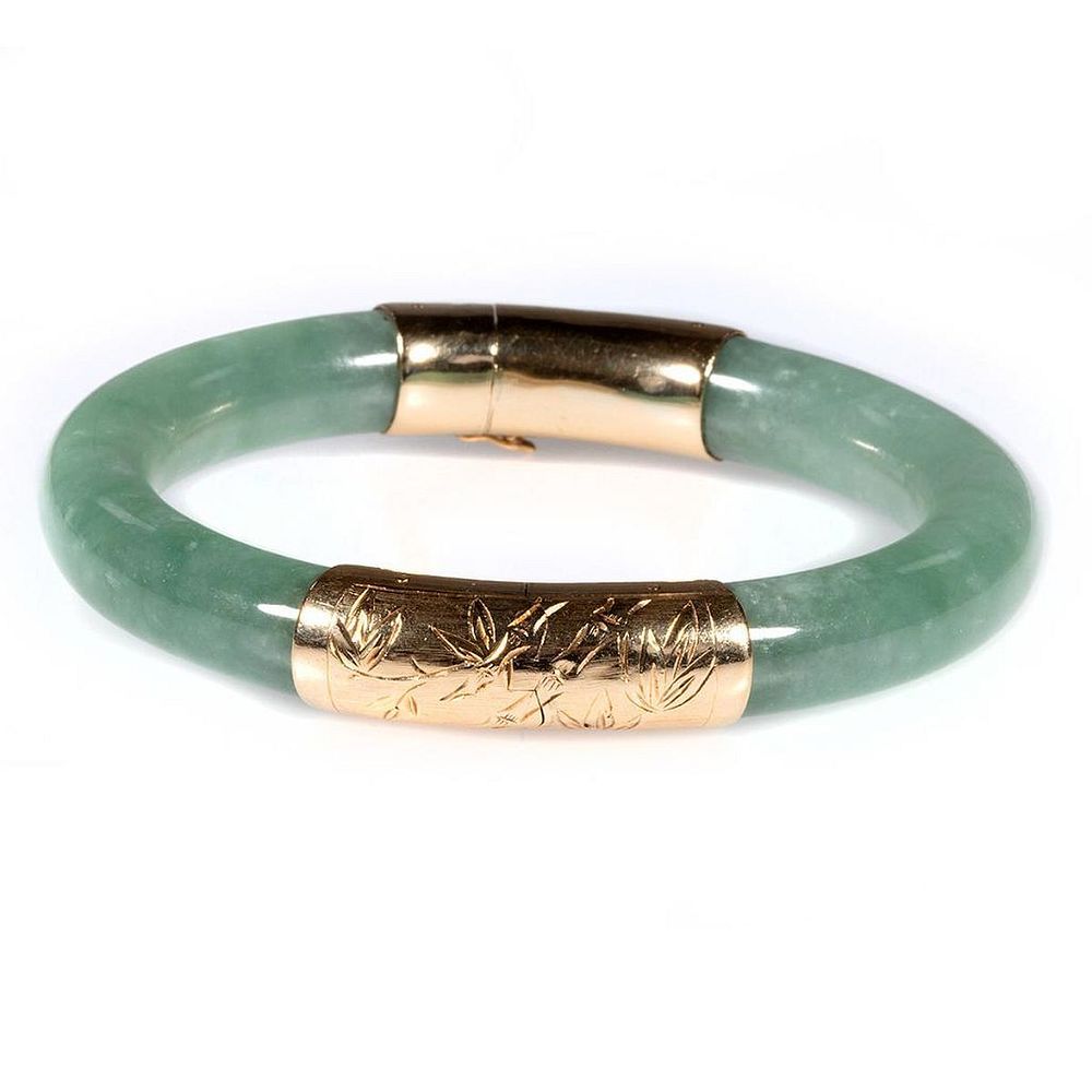 Appraisal: Jade and k gold hinged bangle bracelet the moss green