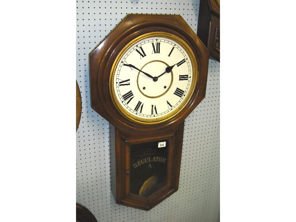 Appraisal: Ansonia mahogany two train drop dial wall clock the white