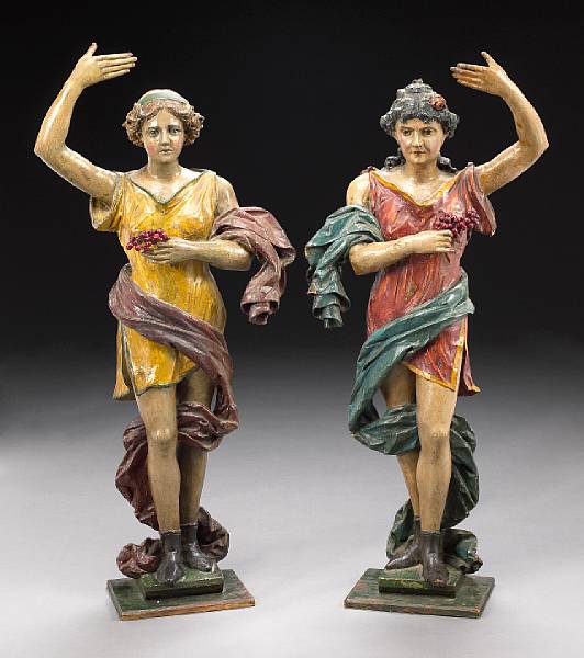 Appraisal: A pair of Belle poque polychrome decorated carved figures of