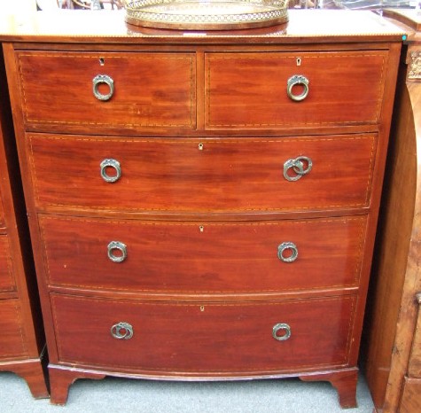 Appraisal: A th century inlaid mahogany dressing chest the three quarter