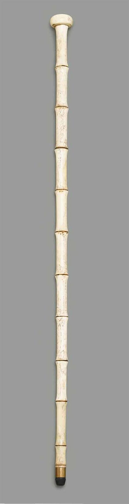 Appraisal: Bone walking stick th century Bamboo-turned L in