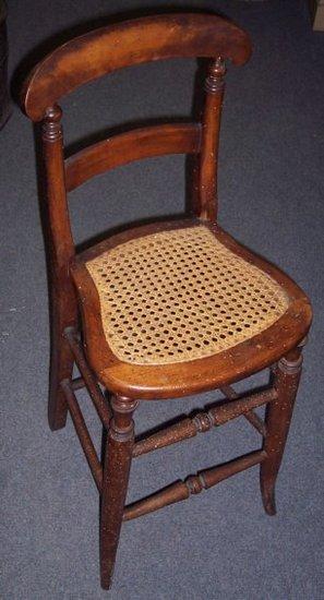 Appraisal: A beechwood deportment chair with cane seat