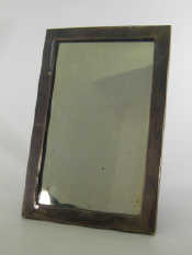 Appraisal: A plain silver framed mirror with strut back Birmingham x