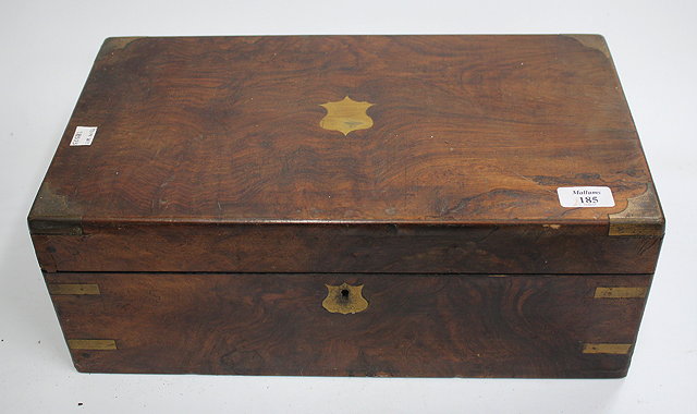 Appraisal: A VICTORIAN WALNUT WRITING BOX with brass mounted corners the