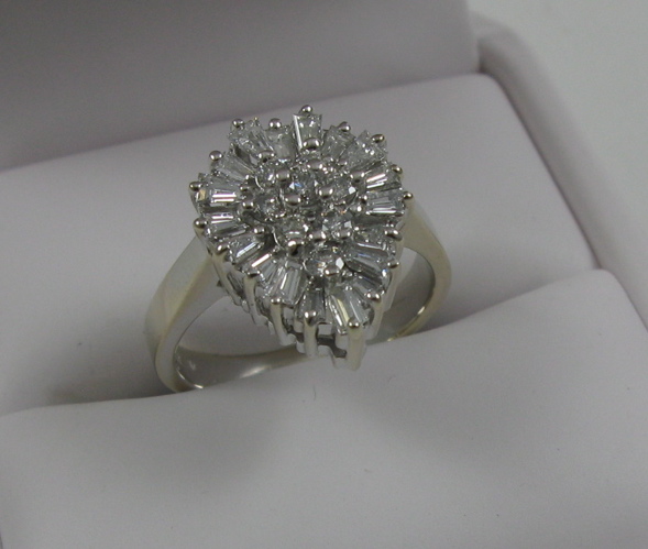 Appraisal: DIAMOND AND FOURTEEN KARAT WHITE GOLD RING set with eight