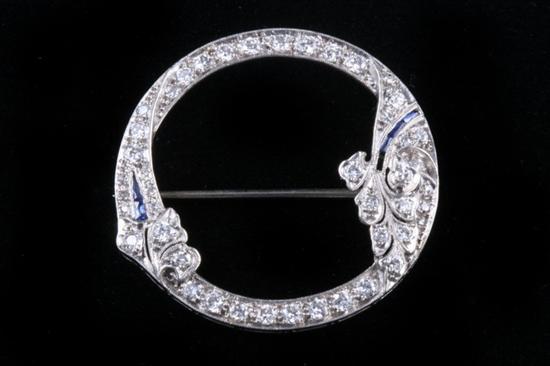 Appraisal: PLATINUM AND DIAMOND FLORAL DESIGN CIRCLE PIN circa Circle of