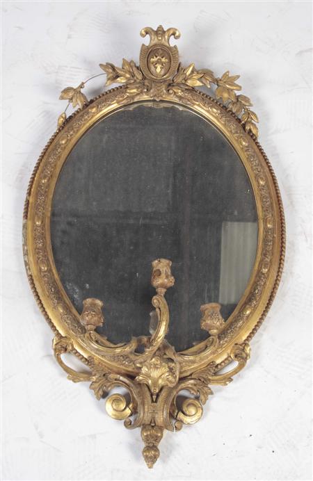 Appraisal: A th century gilt oval mirror the beaded and rope