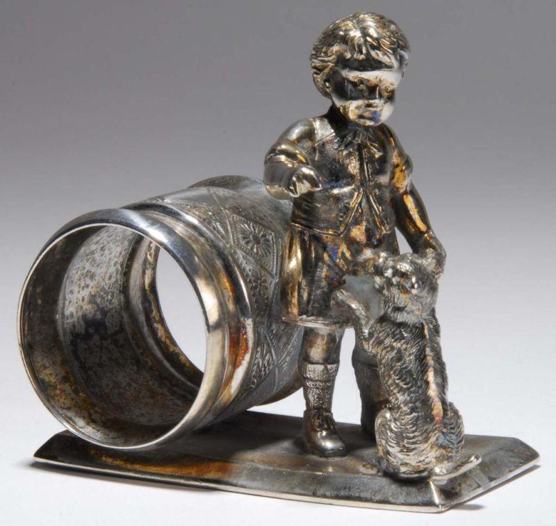 Appraisal: Boy with Begging Dog Figural Napkin Ring Description Little boy