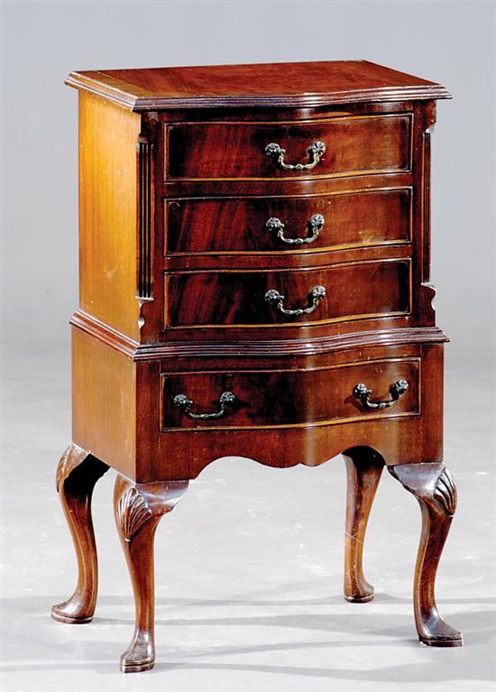 Appraisal: Diminutive English carved mahogany chest-on-chest early th century serpentine case